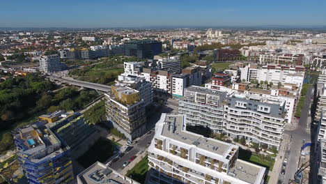Quartier-Port-Marianne-modern-district-Montpellier-with-river-Lez-aerial-drone